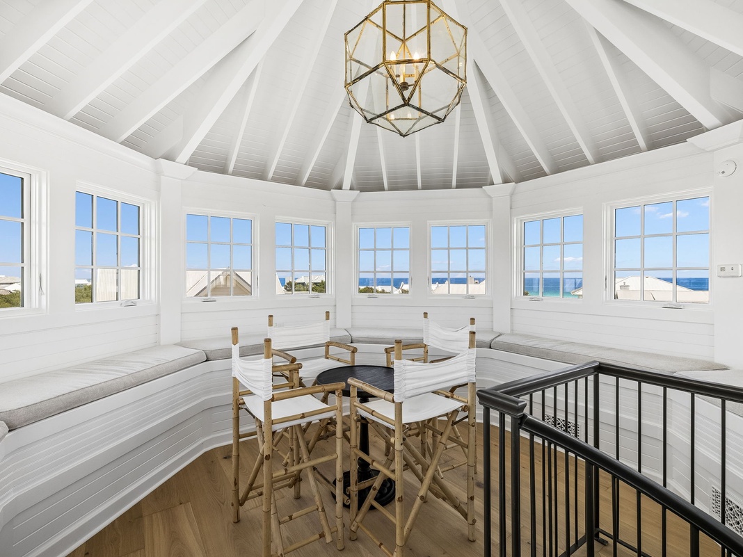 Settle into this stunning circular loft with sweeping windows framing breathtaking ocean views. The airy vaulted ceiling and elegant chandelier create a bright, relaxing retreat perfect for watching the waves.
