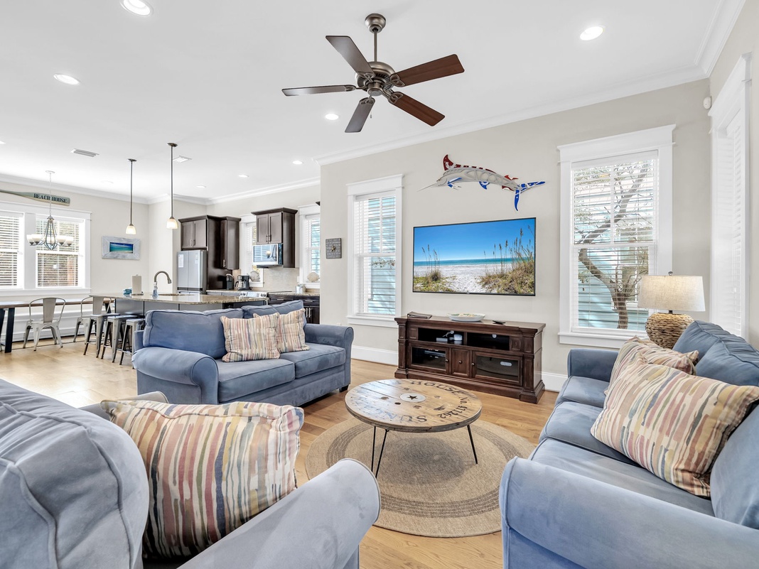 Sink into plush sofas and feel instantly at home in this airy, beach-inspired living space where coastal decor and natural light create your perfect seaside retreat.