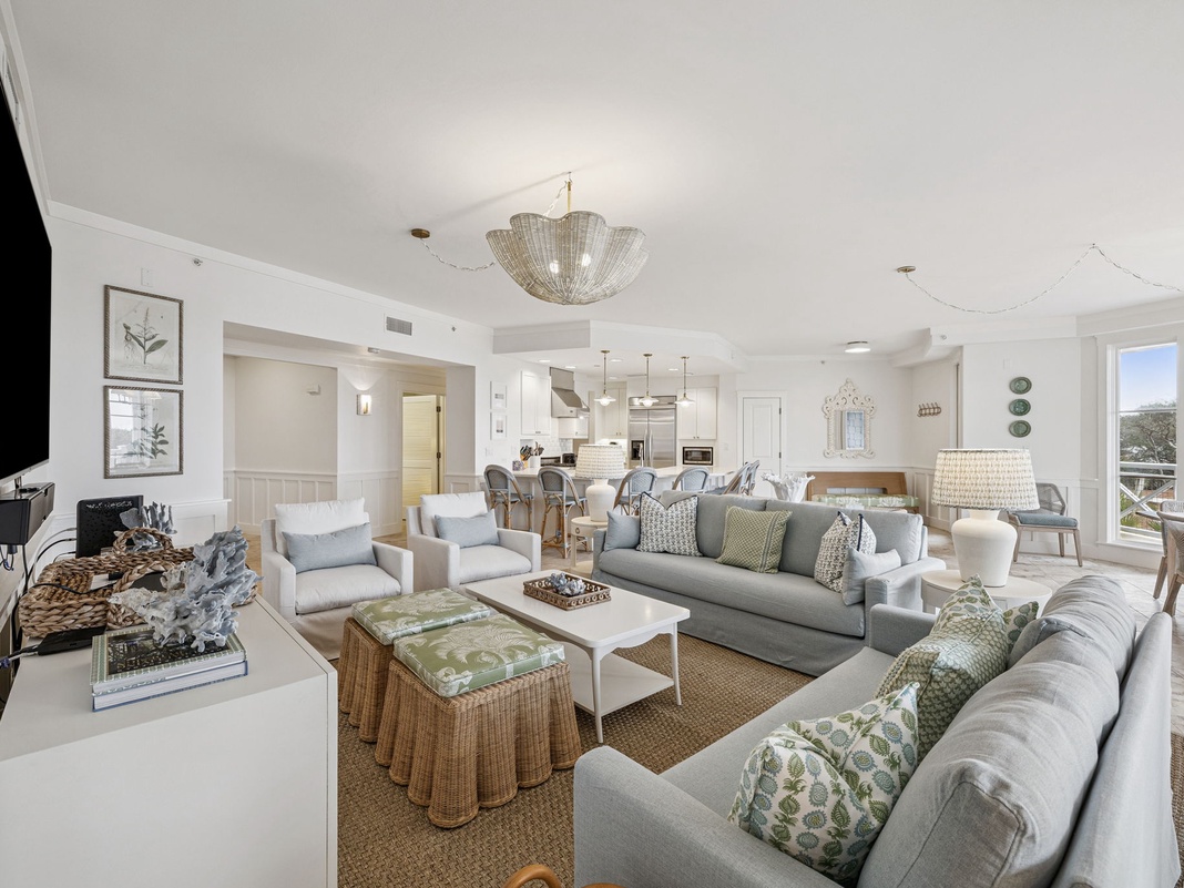 Sink into plush seating surrounded by coastal elegance, where soft textures and breezy hues invite you to relax in your light-filled retreat.