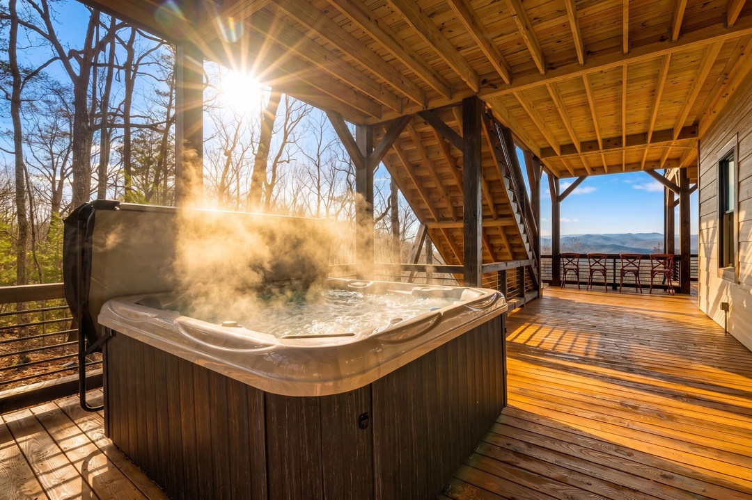 Soak in the steaming hot tub under a sunburst sky, then step out to your expansive covered deck and drink in sweeping mountain vistas—your private escape for total relaxation.