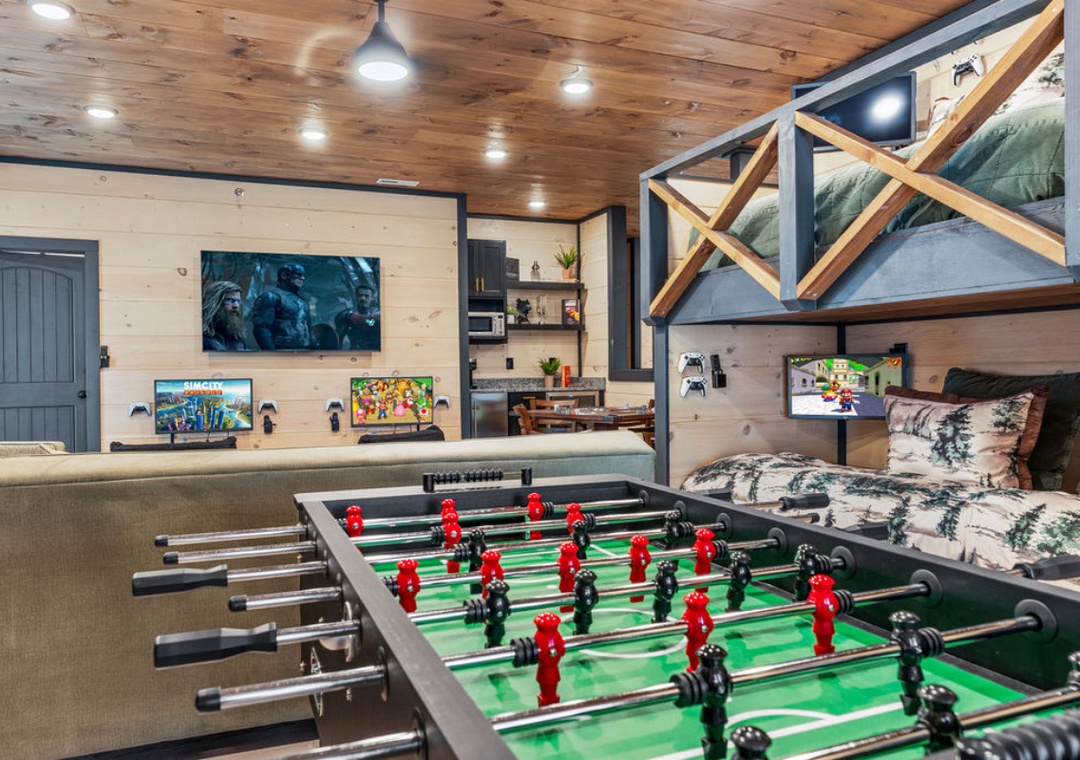 Challenge friends to foosball while cozy bunk beds await after your gaming sessions in this rustic entertainment haven.