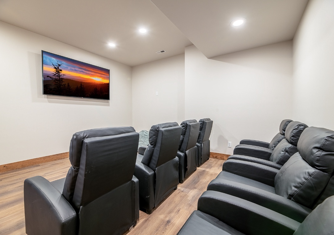 Sink into plush leather recliners in your private theater room, perfect for movie nights with friends and family.