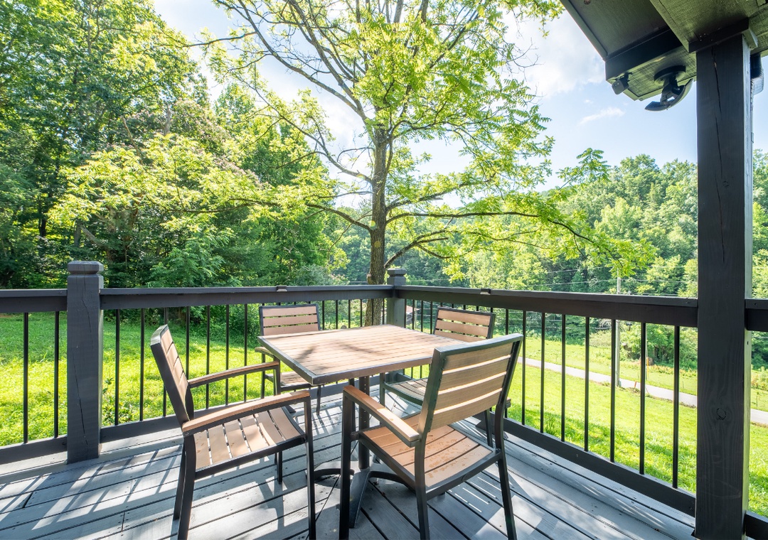 Picture yourself sipping morning coffee at this private table, surrounded by lush greenery and peaceful views. Your shaded outdoor retreat offers the perfect spot to unwind and soak in nature's beauty.