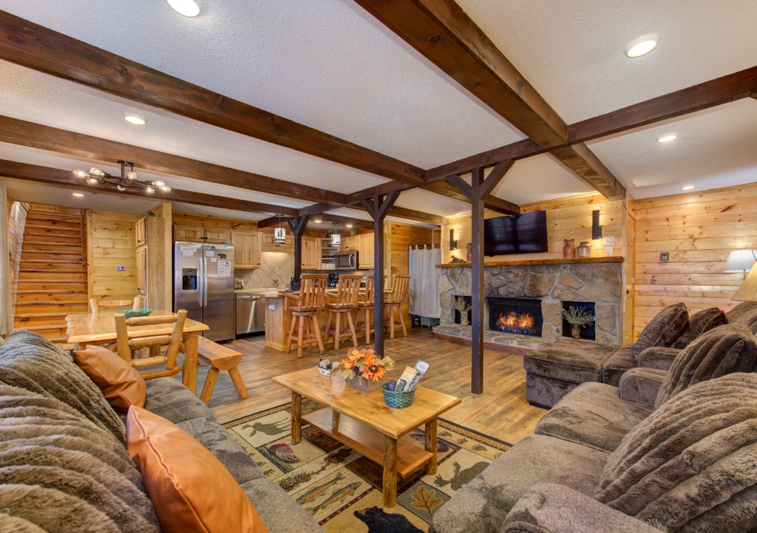 Cozy up in your rustic mountain retreat with crackling fireplace and plush seating perfect for relaxing after adventure-filled days.
