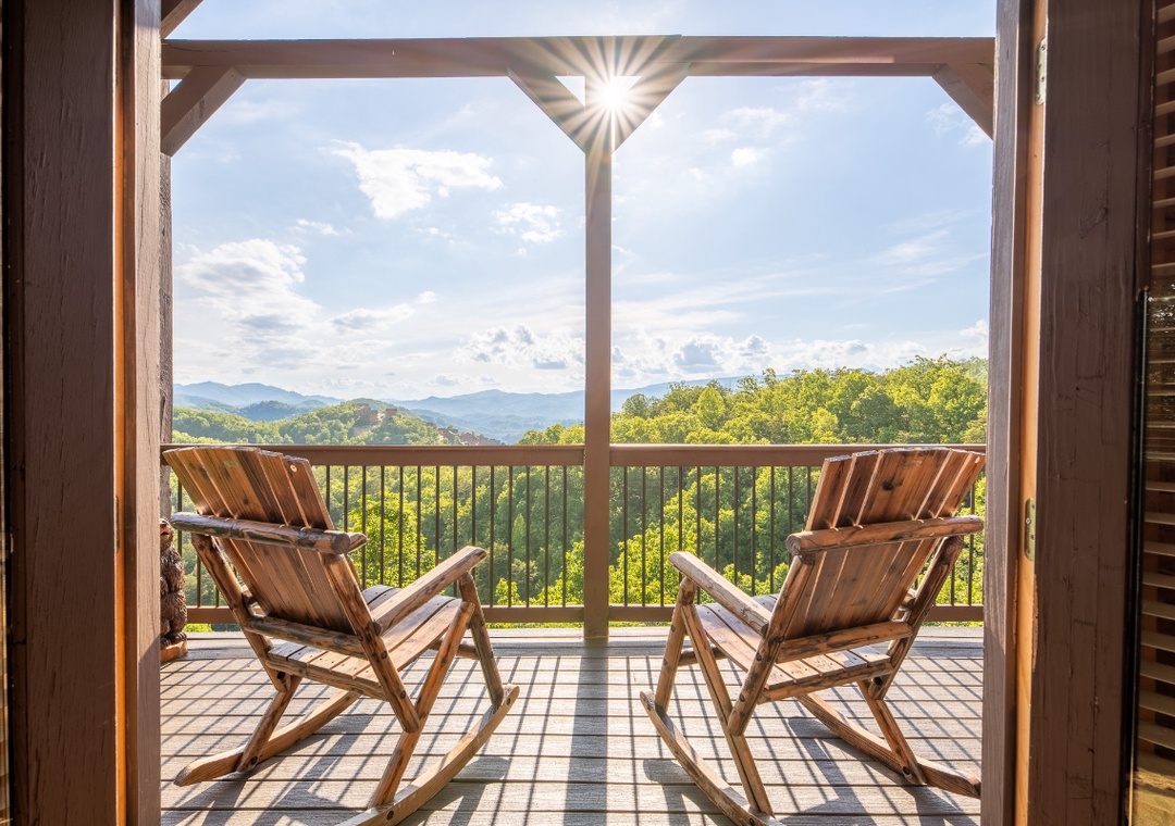 Step onto your private balcony and sink into a cozy chair—sweeping mountain views and rolling forest hills stretch endlessly before you, perfect for morning coffee or sunset relaxation.