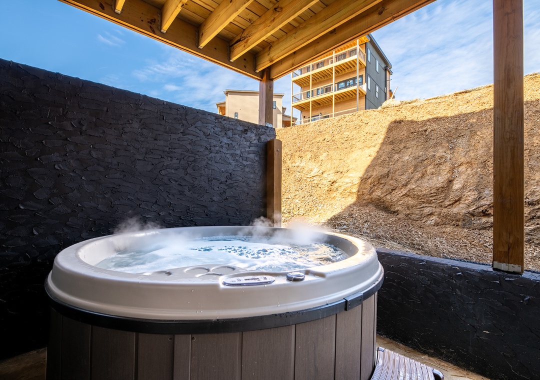 Soak in your private hot tub while watching steam rise.