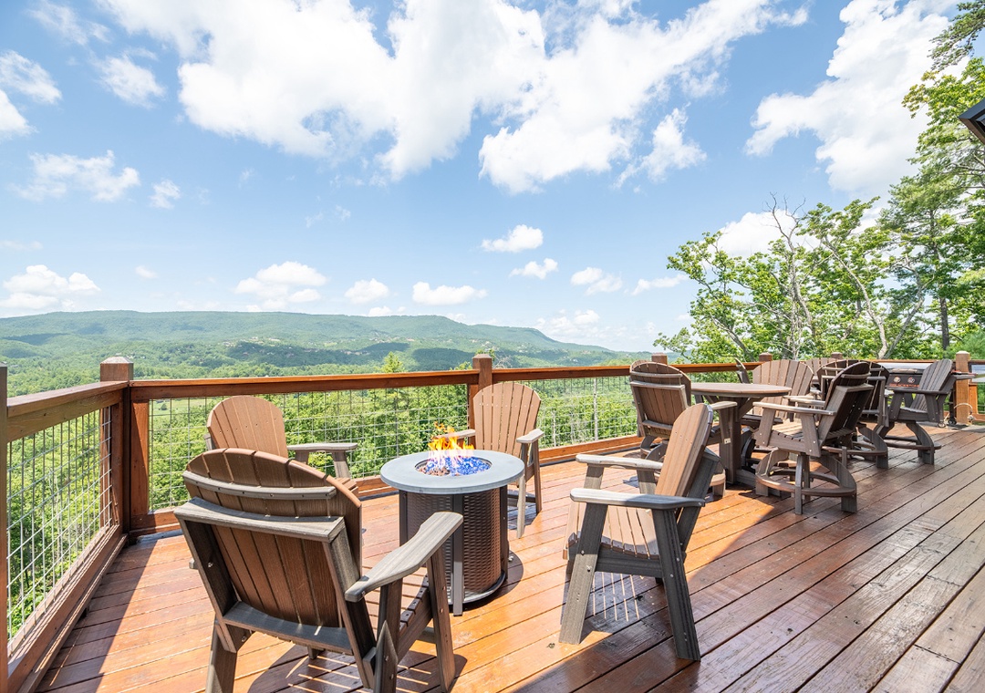 Expansive mountain views stretch across the horizon from your private deck, where Adirondack chairs and a fire table invite you to relax and soak in the fresh air.