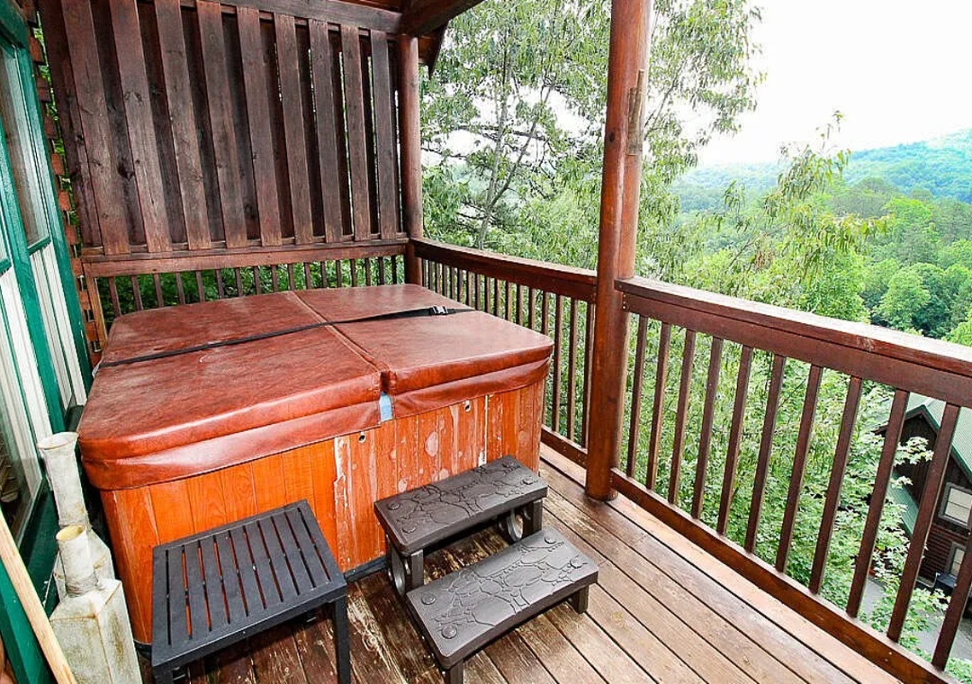 Soak in the warmth while gazing at lush mountain views—your private hot tub awaits on this peaceful terrace surrounded by nature.