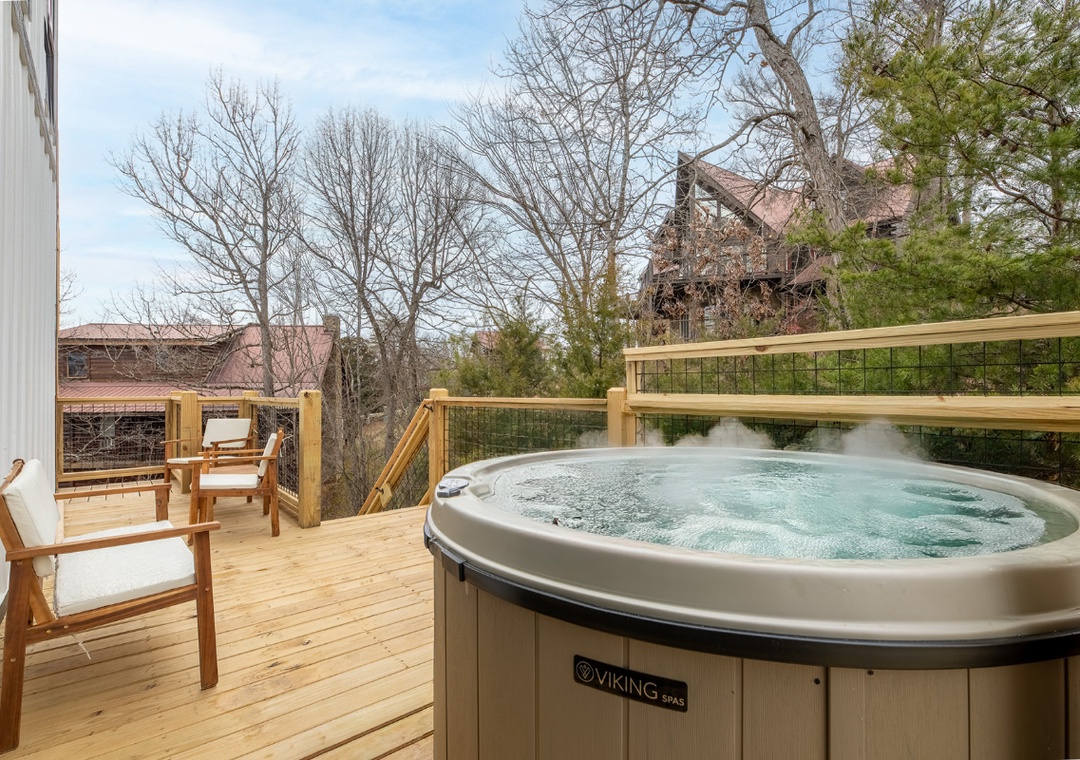 Soak away your stress in this bubbling hot tub while enjoying peaceful neighborhood views from your private deck.