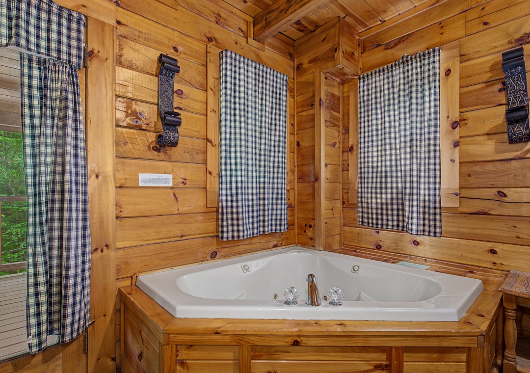 Unwind in your private corner jetted tub surrounded by warm decor—a cozy retreat made just for relaxation.