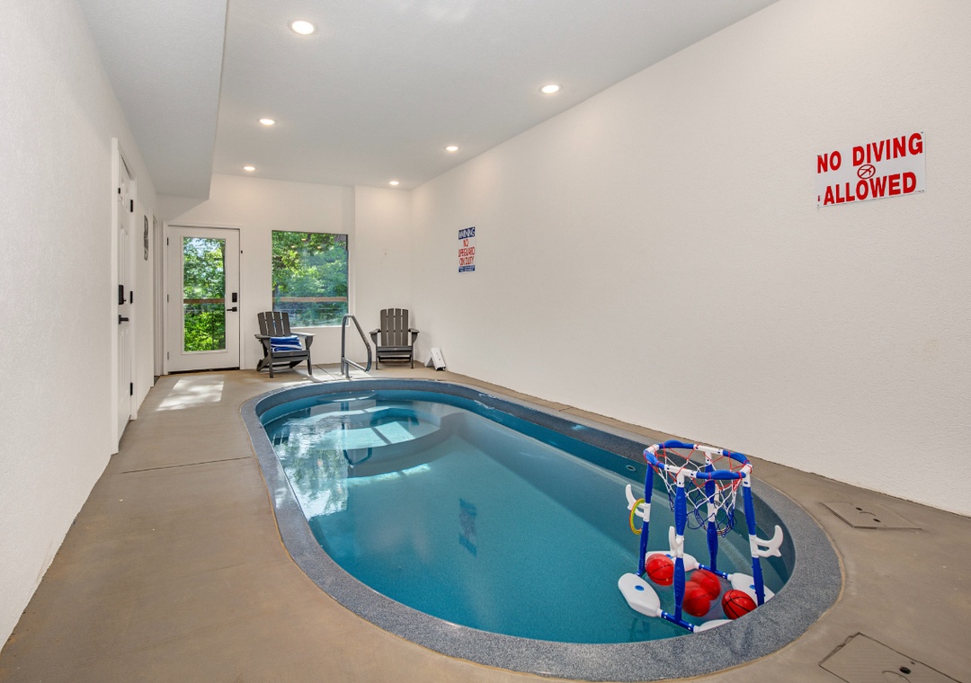 Dive into your own private indoor pool anytime, with handrails for easy access, lounge chairs to relax, and doors opening to the greenery outside.