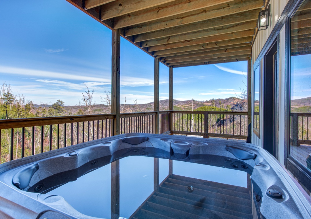 Soak in your private hot tub while taking in breathtaking mountain views from your covered deck—pure relaxation awaits.