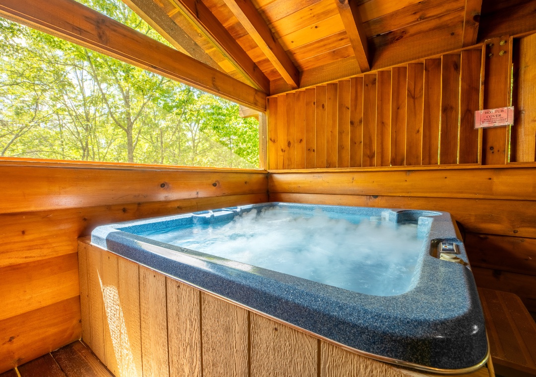 Sink into warm, bubbling waters while gazing at lush forest views from your private hot tub—a perfect spot to unwind and reconnect with nature.