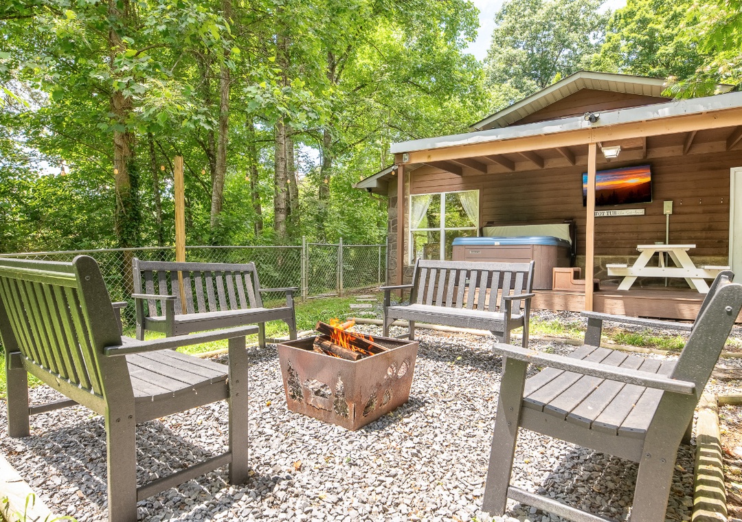 Gather around the fire pit for cozy evenings under the trees, or soak in the hot tub just steps away from your private outdoor retreat.