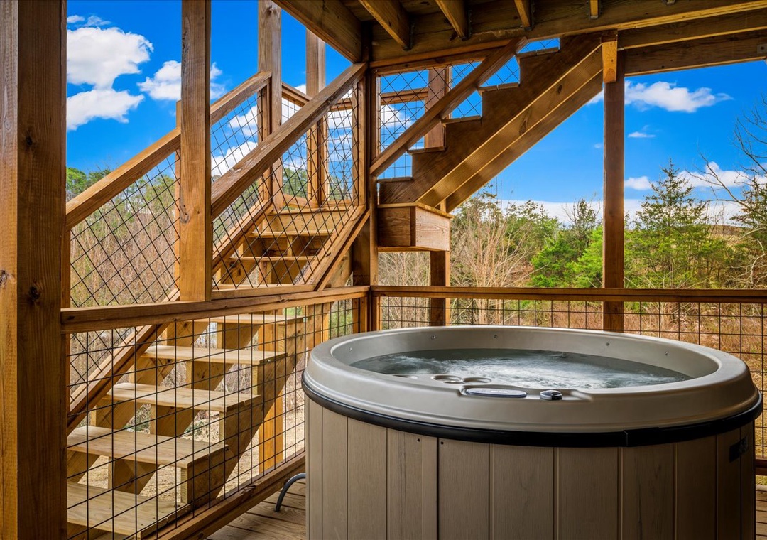 Soak your worries away in this private hot tub on your secluded deck, surrounded by peaceful forest views.