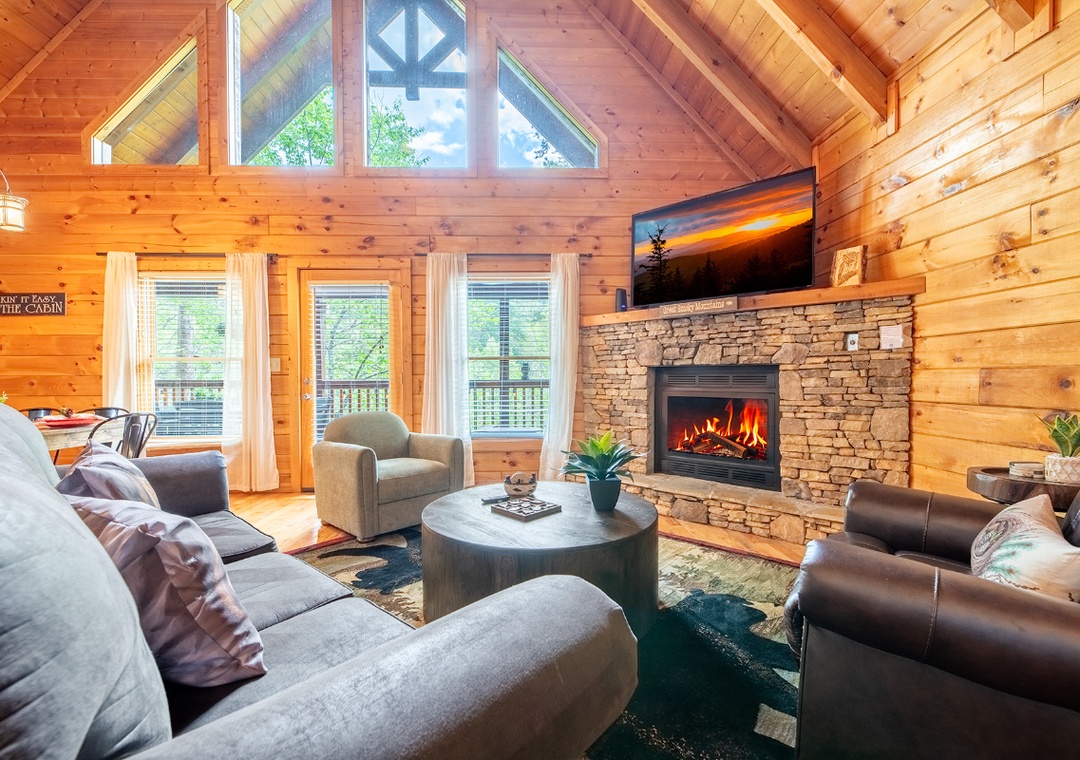 Cozy up in this warm cabin living room where crackling flames and rustic charm create your perfect mountain retreat sanctuary.