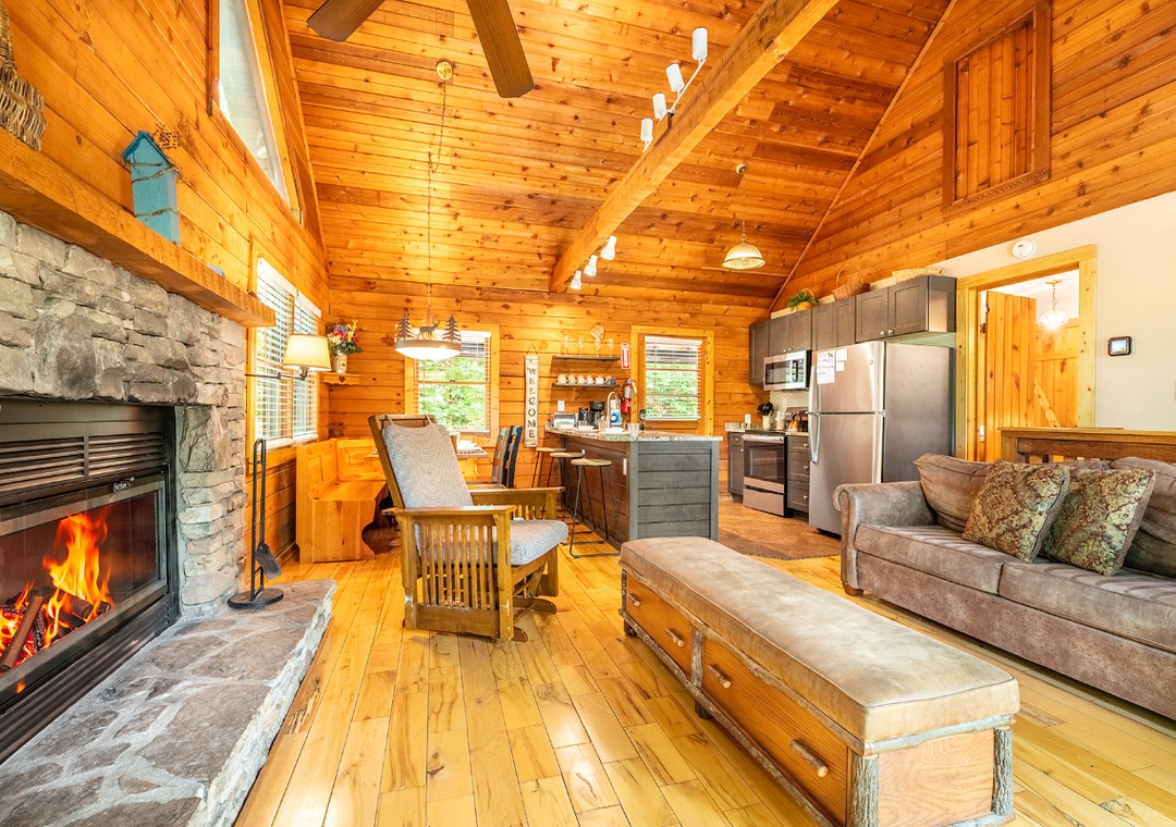 Wrap yourself in the warmth of soaring wood ceilings, a crackling stone fireplace, and an open living space that invites you to unwind, cook, and gather.