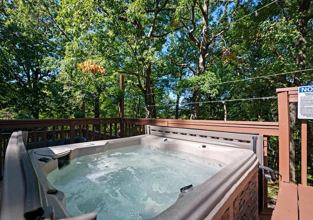 Soak under dappled sunlight and towering trees in your private hot tub, surrounded by lush forest and birdsong—an ideal retreat after exploring the area.