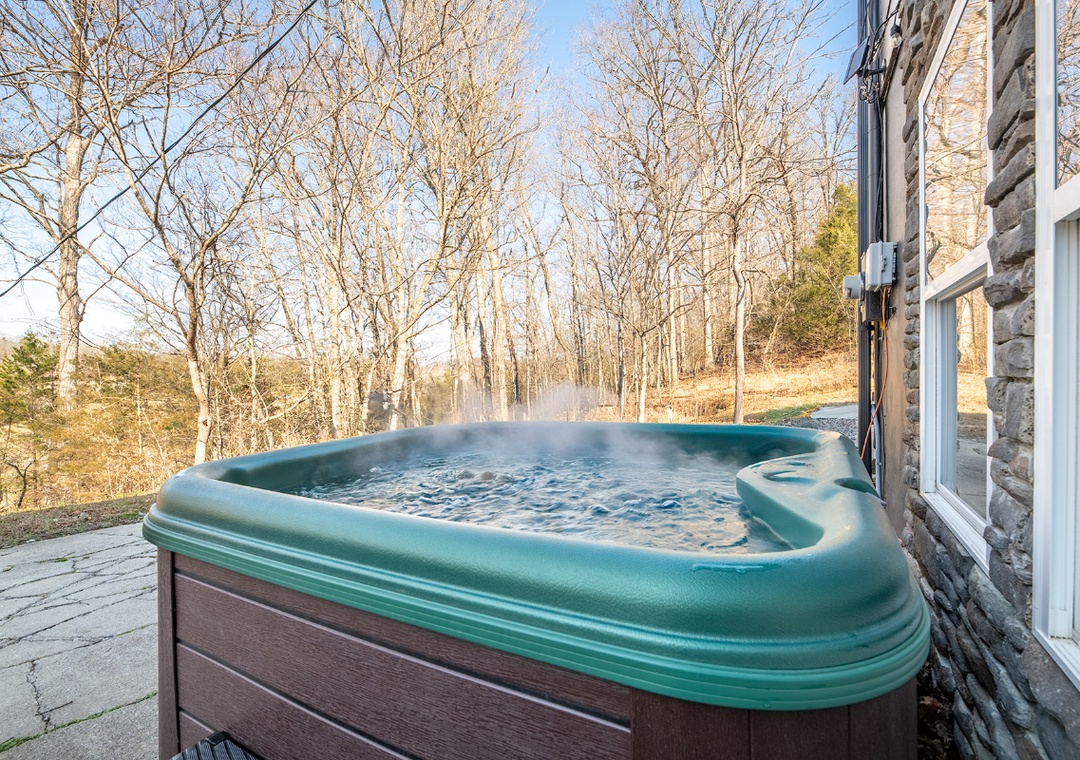 Soak your worries away in this steaming hot tub while enjoying peaceful wooded views from your private deck.