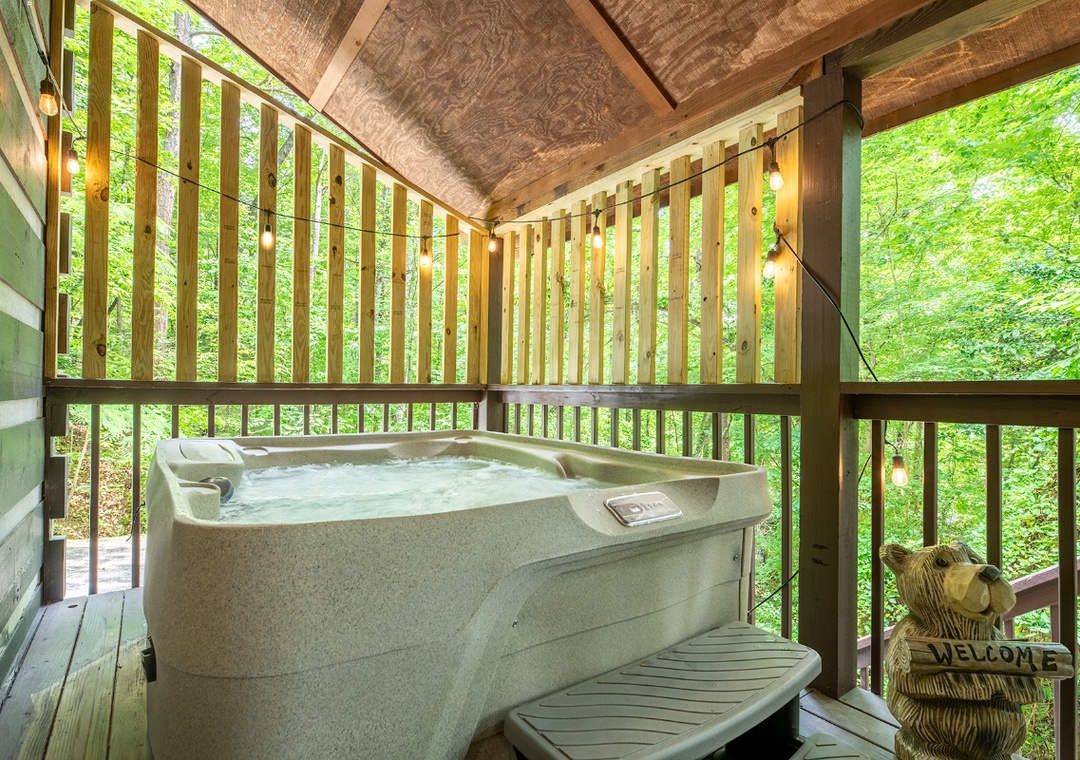Soak in your private hot tub surrounded by lush forest views—a peaceful retreat where nature becomes part of your relaxation.