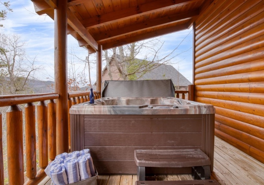 Soak away your cares in this private hot tub on your covered deck, surrounded by peaceful wooded views.