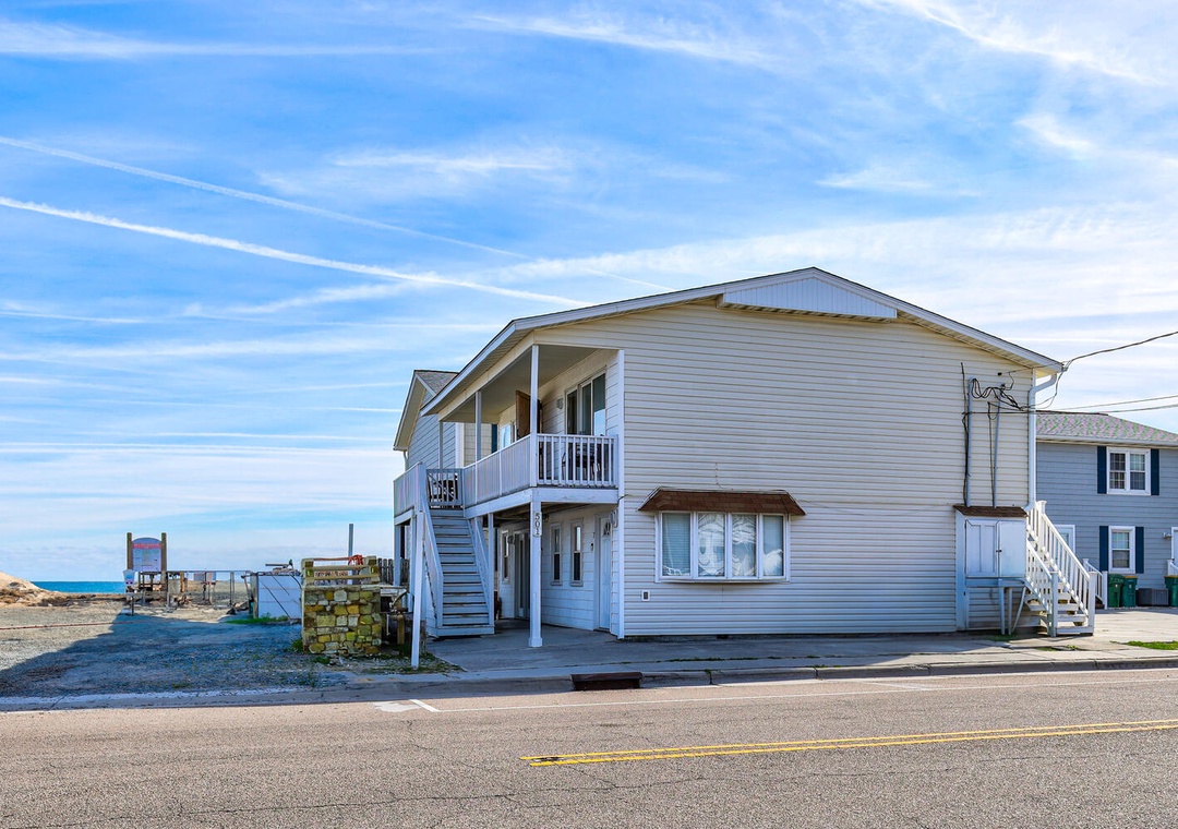 Beachside property offers coastal charm with ocean access just steps from your door.