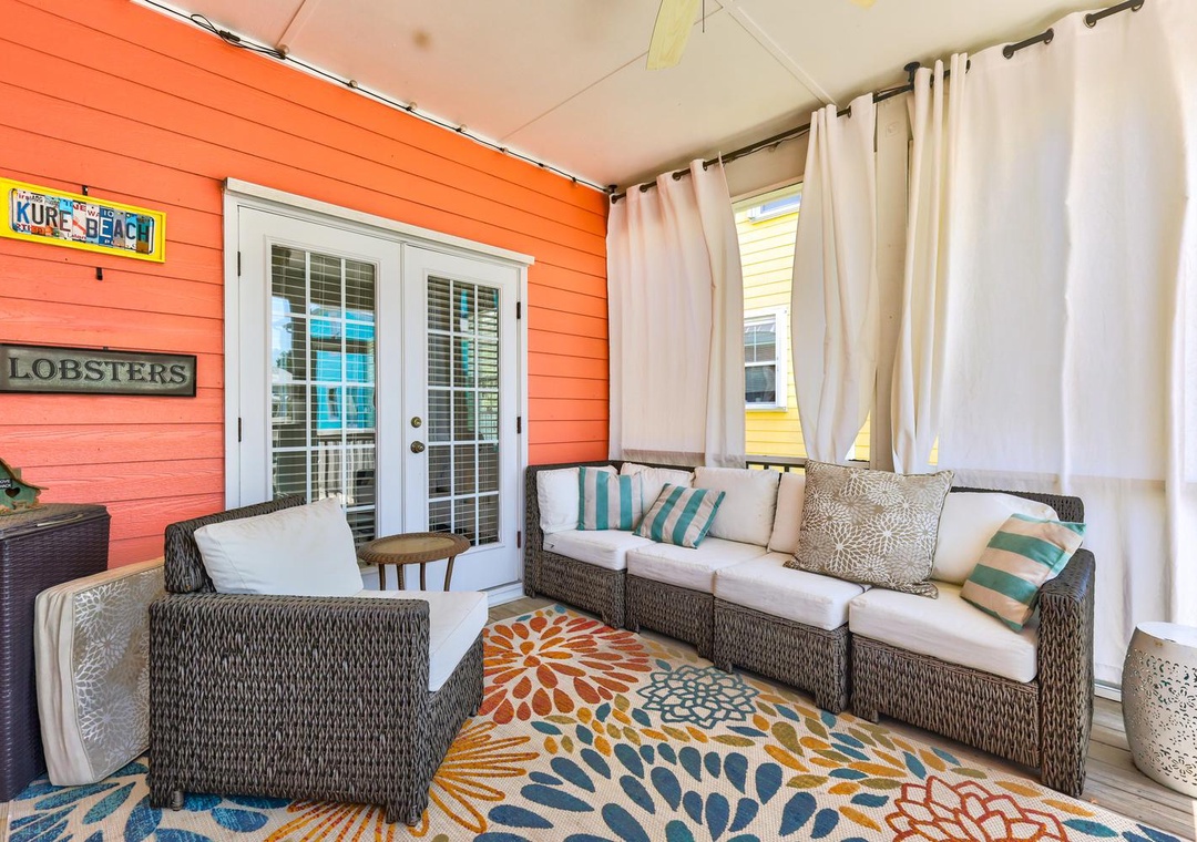 Unwind on your private, covered patio with plush seating and coastal charm—your perfect spot for morning coffee or evening relaxation.