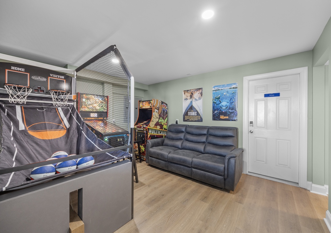 Your own private game room awaits with arcade fun, basketball hoops, and cozy seating—perfect for unwinding after exploring or spending quality time with loved ones.