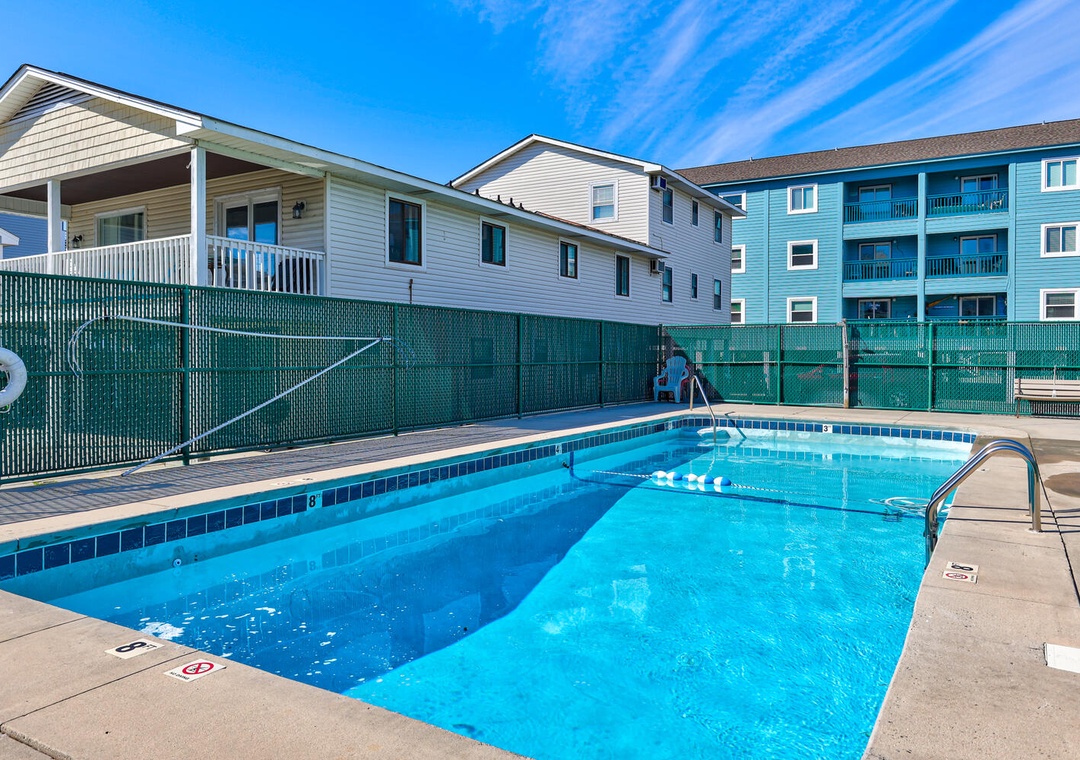 Your private pool oasis awaits with crystal-clear blue waters, perfect for refreshing dips under sunny skies.