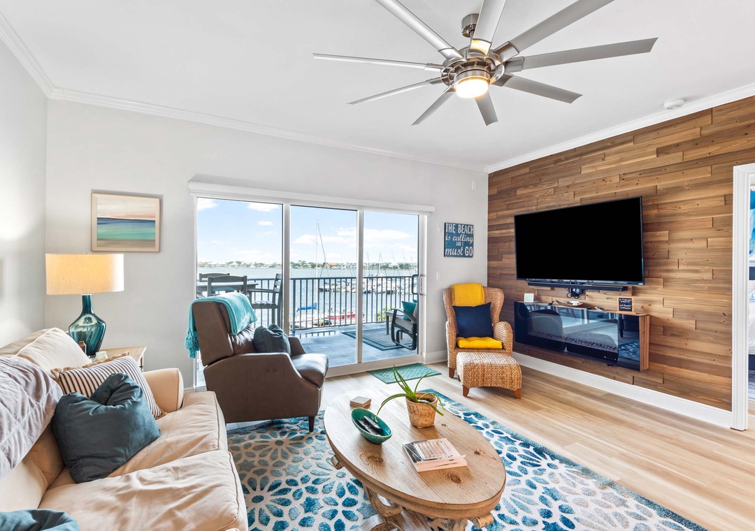 Living room with large flat-screen TV and fireplace