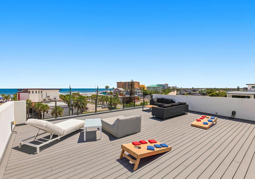 Rooftop with ocean views and cornhole game