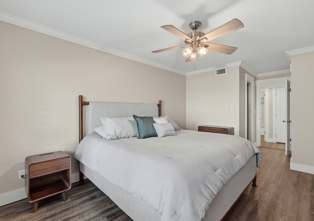 The primary bedroom with comfortable king bed