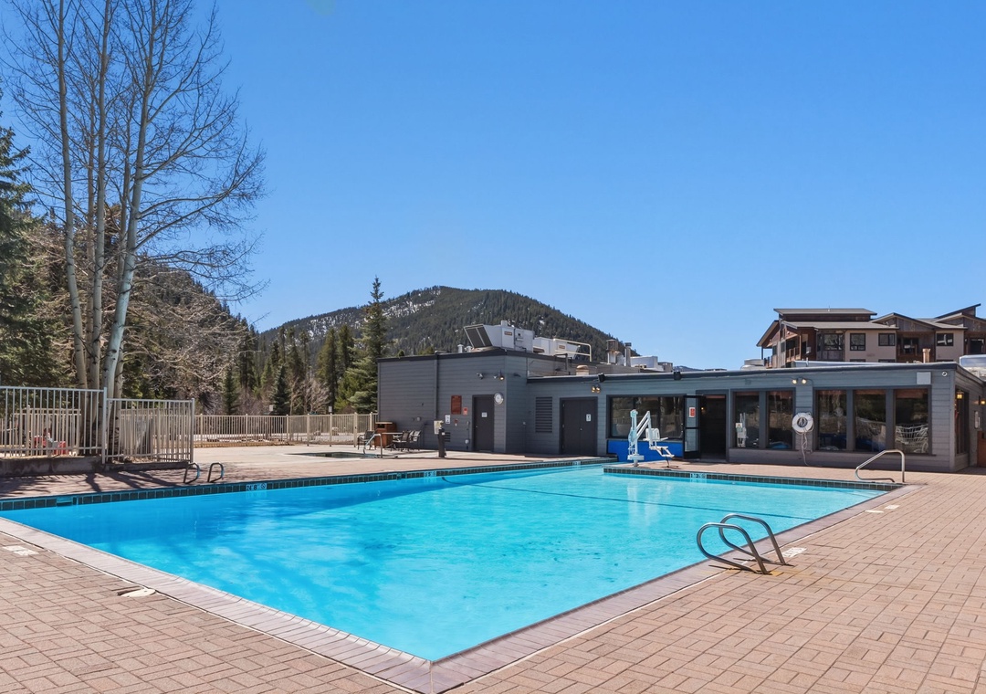 The outdoor pool awaits, surrounded by mountain views — guests are a quick walk to the amenities available at Keystone Lodge & Spa