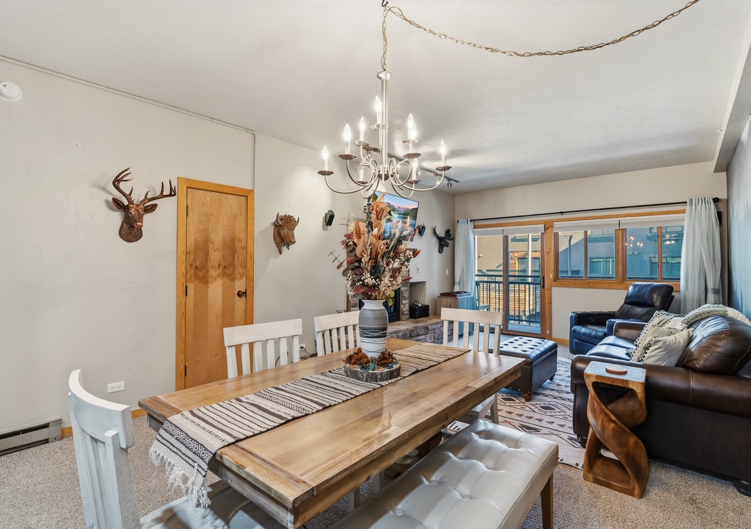 Gather around the rustic dining table and unwind in your bright, spacious living area, where alpine charm meets cozy elegance for unforgettable mountain getaways.