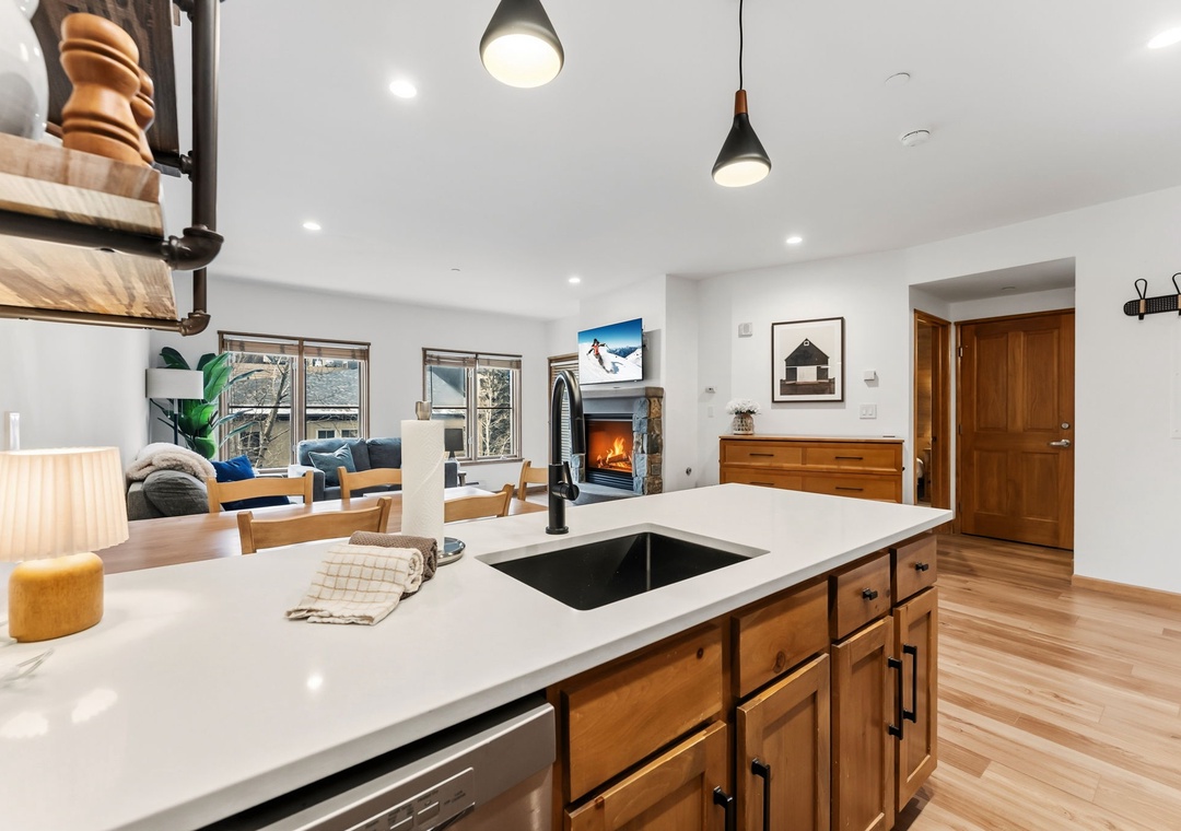 Gather around your spacious kitchen island while the fireplace crackles nearby, creating the perfect atmosphere for memorable meals and conversations.
