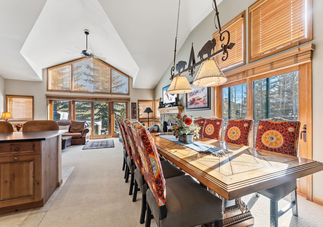 Gather around your elegant dining table where warm sunlight streams through panoramic windows, creating the perfect setting for memorable meals.