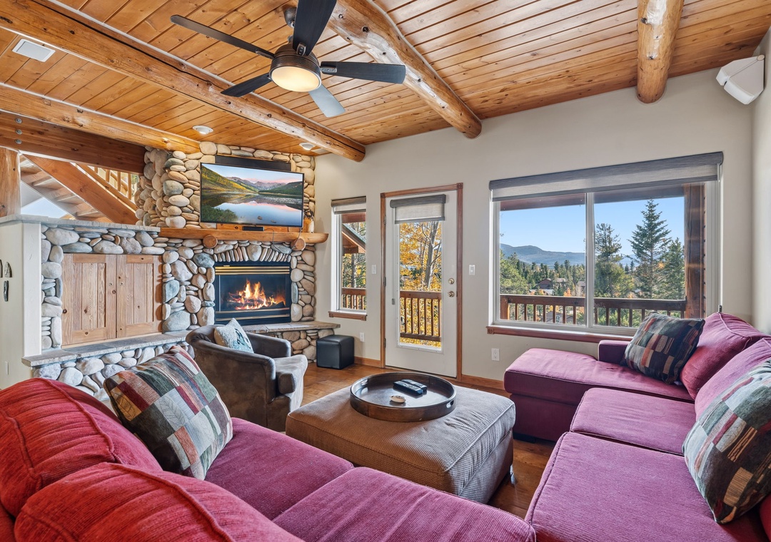 Relax by the stone fireplace in your inviting living room