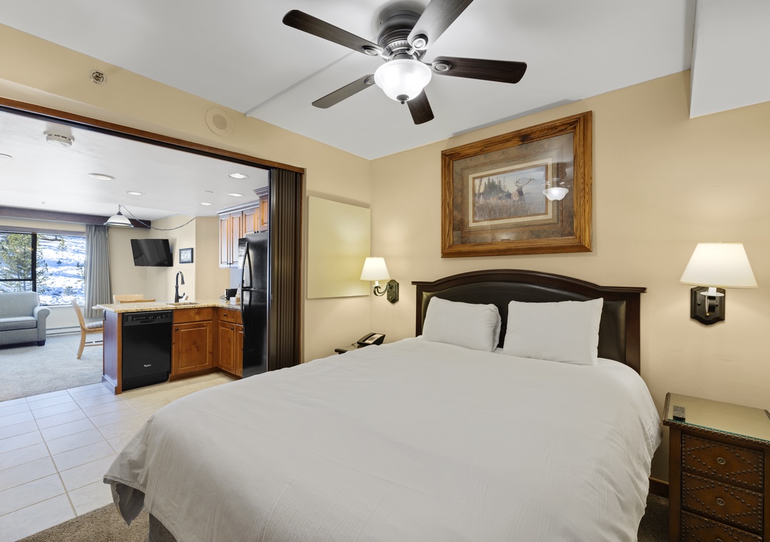 Relax in your spacious bedroom with comfortable linens and open layout connecting to your fully-equipped kitchen.