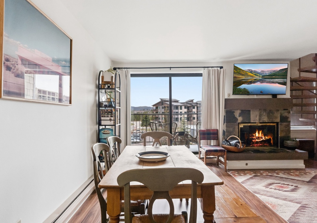 Gather around this warm dining space where crackling fireplace flames create the perfect ambiance for your mountain retreat meals and memorable conversations.