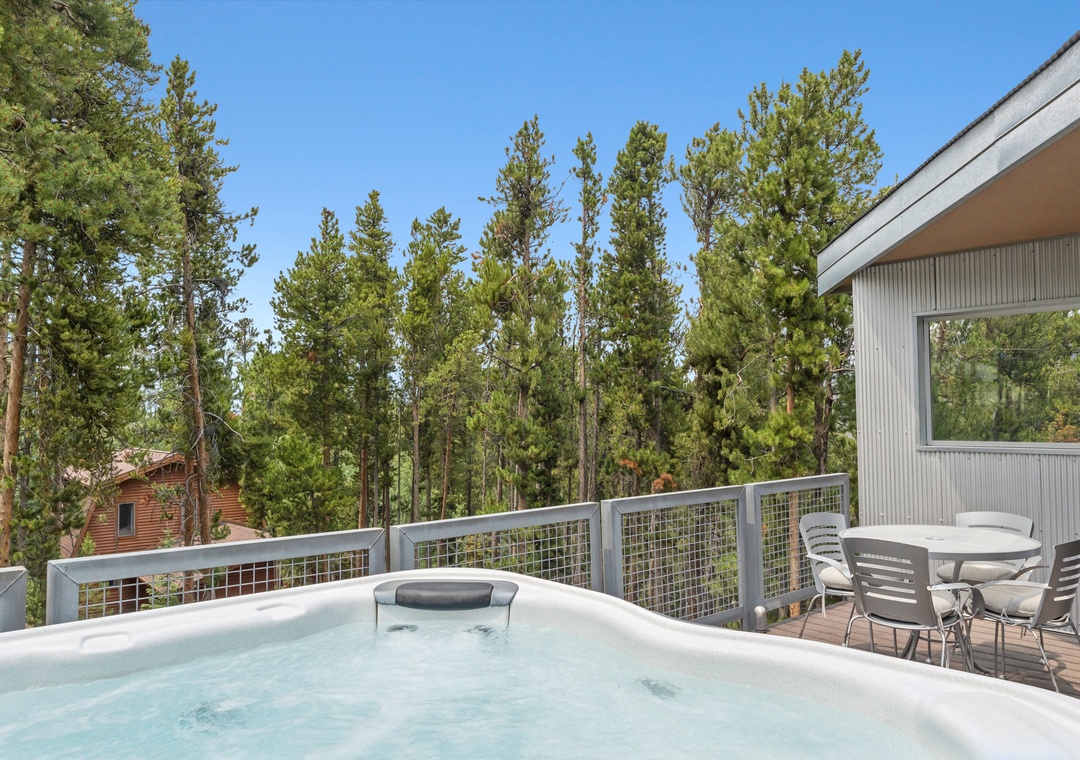 Unwind in your private hot tub on the spacious deck, surrounded by towering pines and fresh mountain air. Your perfect retreat awaits.