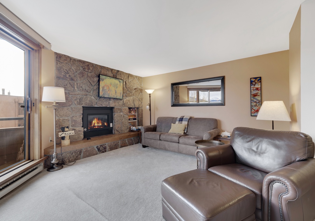 Cozy Living Room with Fireplace and Large Deck