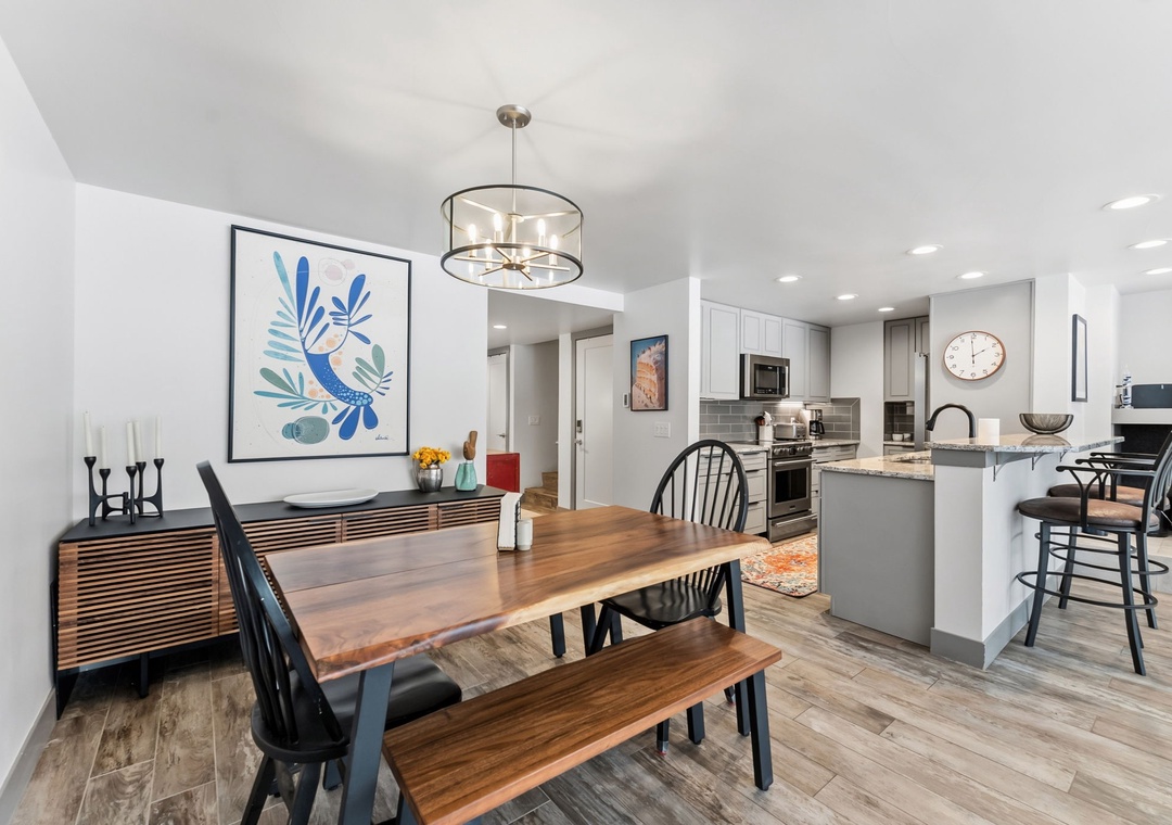 Gather around your beautiful dining table and enjoy meals in this bright, open space that flows seamlessly into your fully-equipped kitchen.