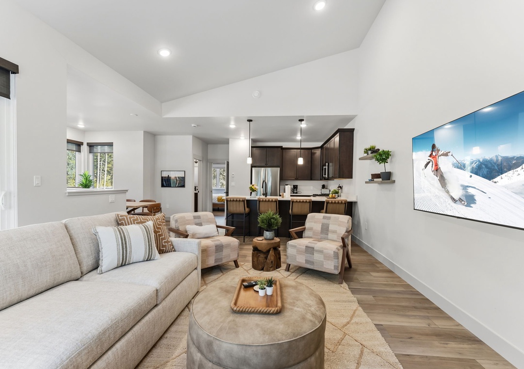 Sink into your plush sectional and enjoy seamless indoor-outdoor living in this bright, modern space with gourmet kitchen.