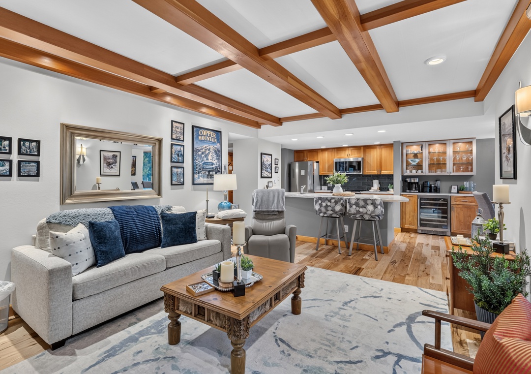 Gather in this inviting open-concept space where warm wood beams and modern mountain decor create the perfect retreat after your alpine adventures.