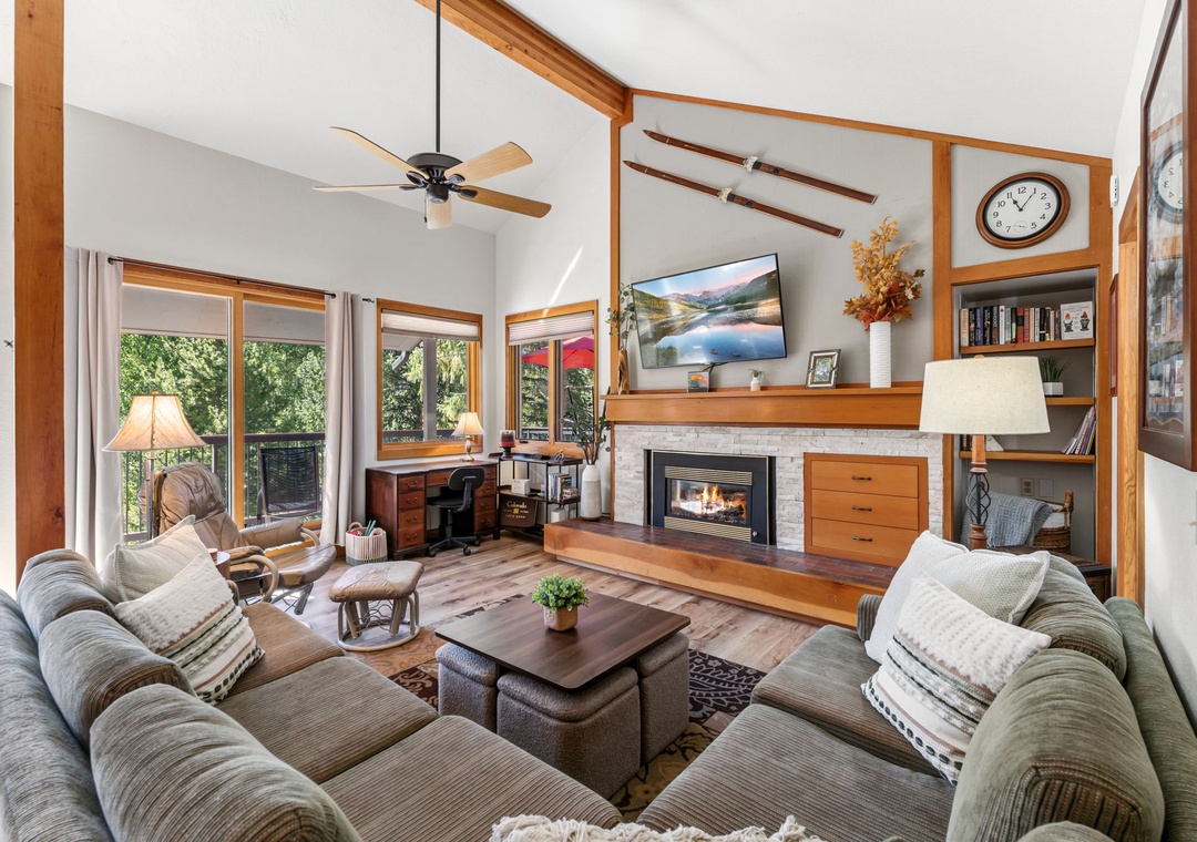 Sink into plush couches by the glowing fireplace, perfect for evenings with your group after exploring nearby mountain trails.