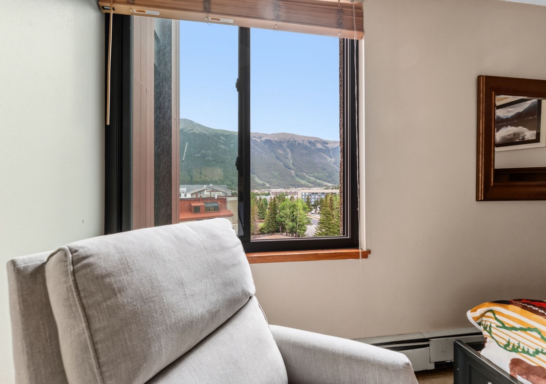 Sink into your cozy armchair and take in the stunning mountain views right from your window. The perfect spot to unwind and soak up the natural beauty surrounding you.