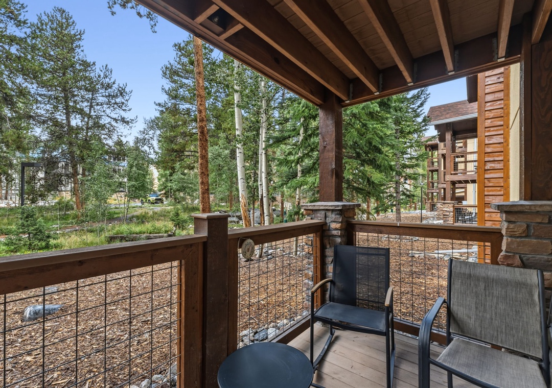Relax on your private covered deck overlooking towering pines and peaceful mountain surroundings. The natural wood finishes and fresh alpine air make this the perfect spot to unwind with morning coffee or an evening drink.