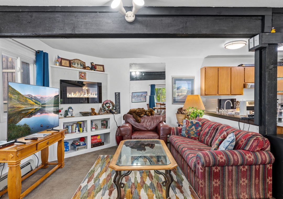 Unwind in your cozy living space and an open layout that flows into a fully-equipped kitchen—your perfect mountain escape awaits.