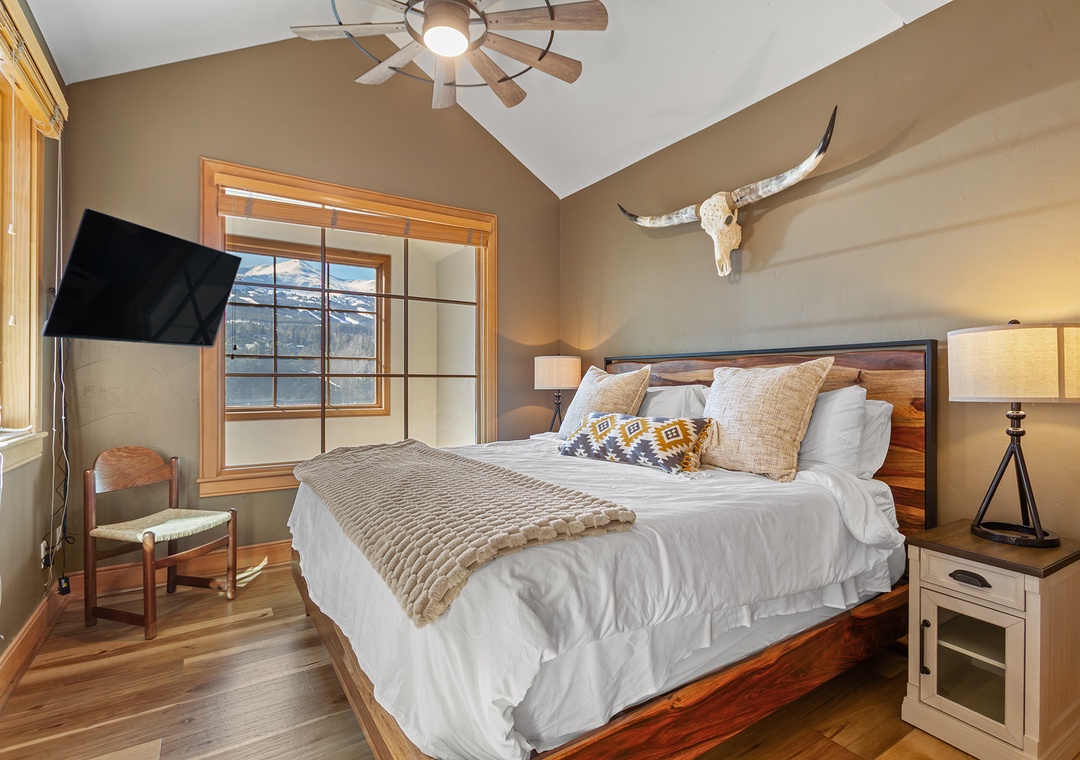 Drift off to sleep surrounded by rustic charm and modern comfort in your mountain retreat bedroom.