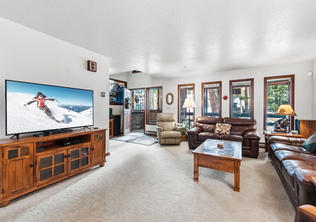 Sink into plush leather seating in your spacious living room, where mountain adventures on the large TV inspire your next outdoor escapade.